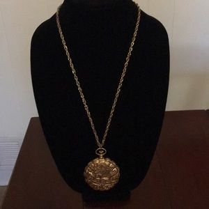 Pretty gold locket with mirror inside